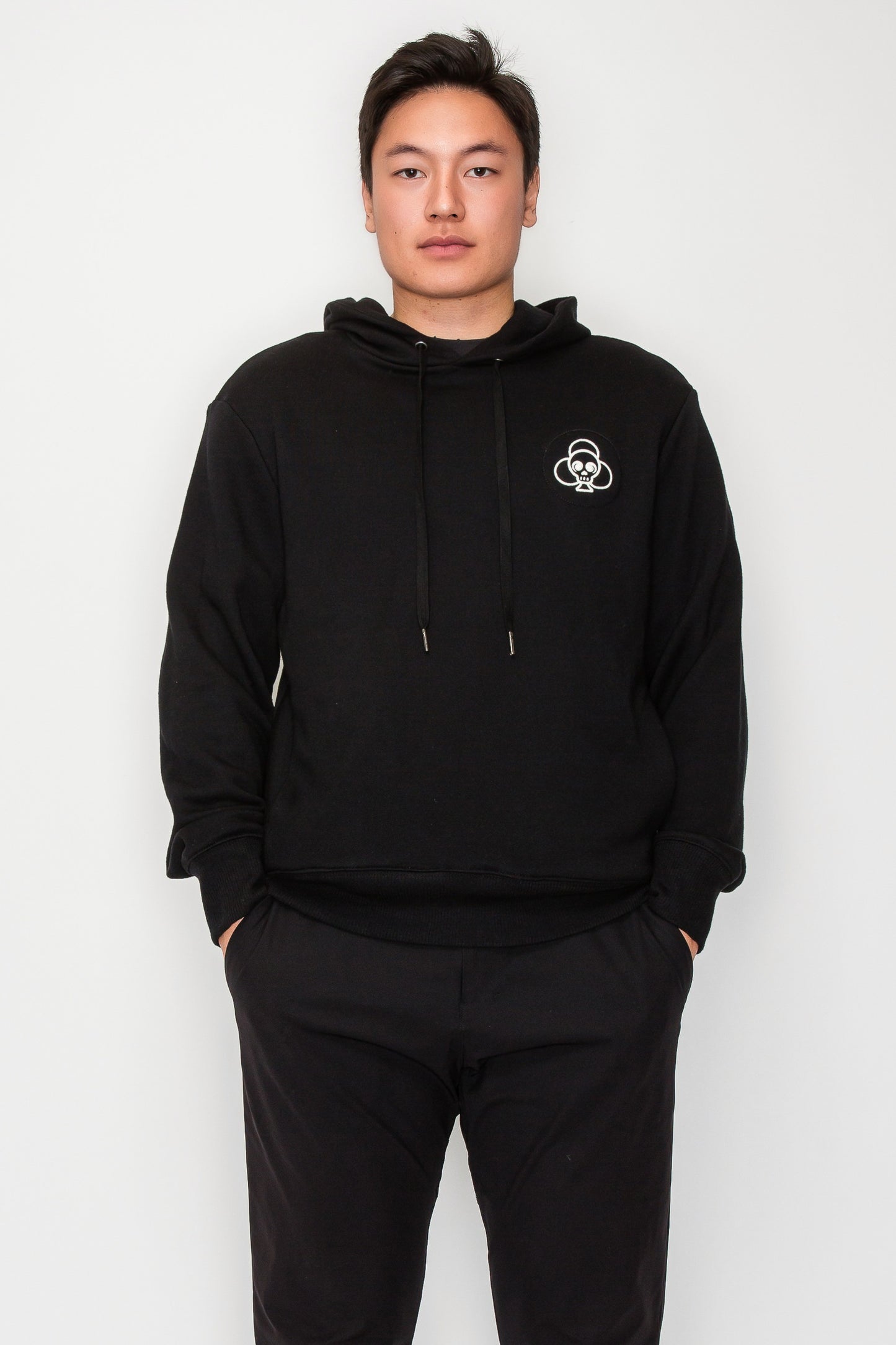 Asian model with CS hoodie front with embroidered logo